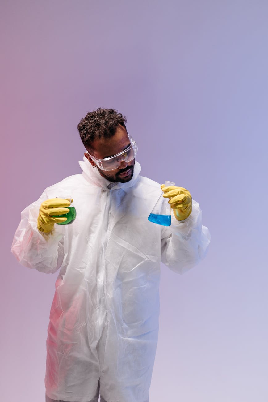 scientist holding flasks in hands